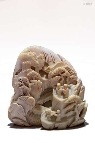 A CHINESE CALCIFIED JADE FIGURES BOULDER