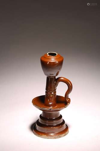 A CHINESE BROWN GLAZED OIL LAMP