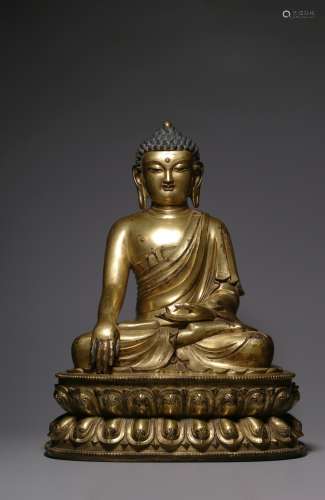 A CHINESE GILT BRONZE FIGURE OF SHAKYAMUNI