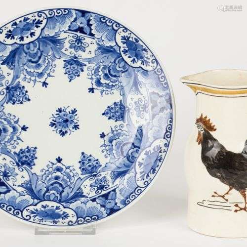 A lot of earthenware consisting of a plate and a jug, both m...