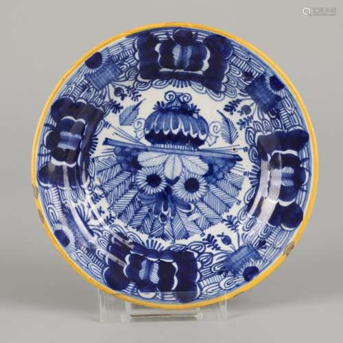 An earthenware peacock plate, marked 
