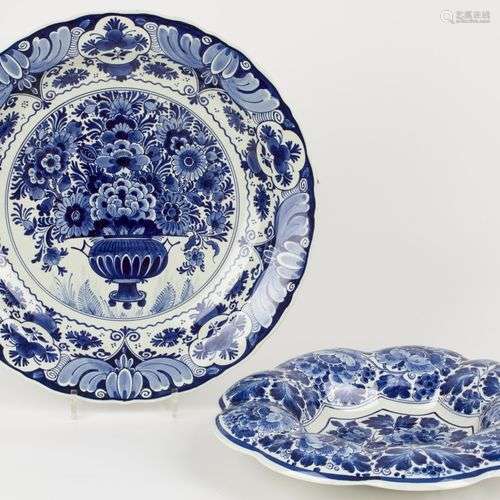 A lot of (2) earthenware dishes with floral decoration, mark...