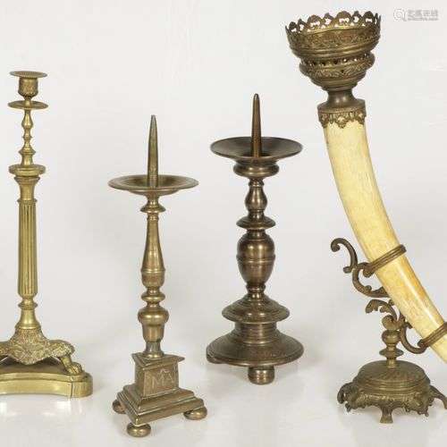 A lot of various bronze candlesticks and a horn with bronze ...