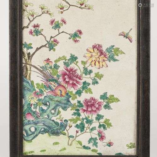 An earthenware Famille Rose plaque in a wooden frame. China,...