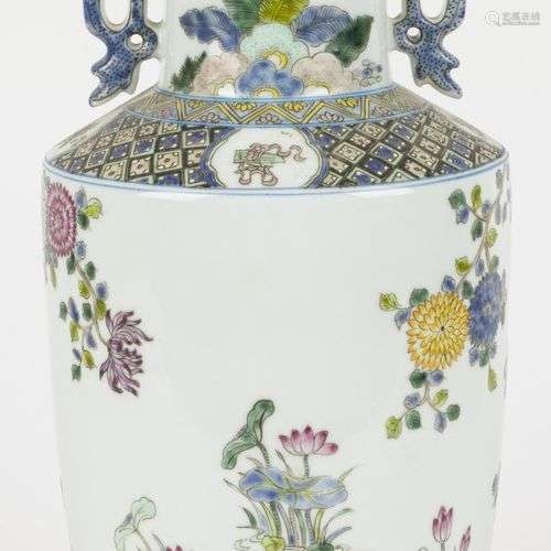 A porecelain vase decorated with peonies and birds. China, 2...