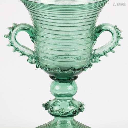 A green glass goblet, mouth blown.