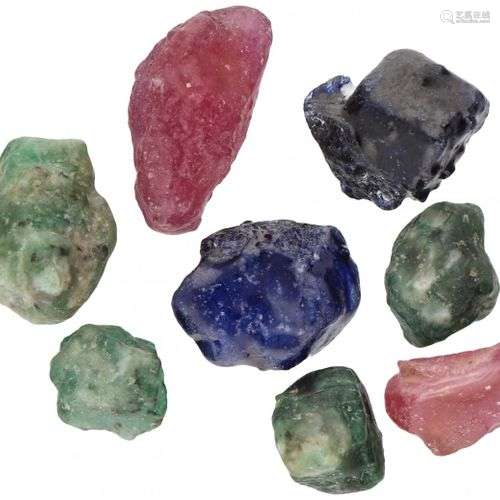 Lot comprising rough sapphires, rubies and emeralds.