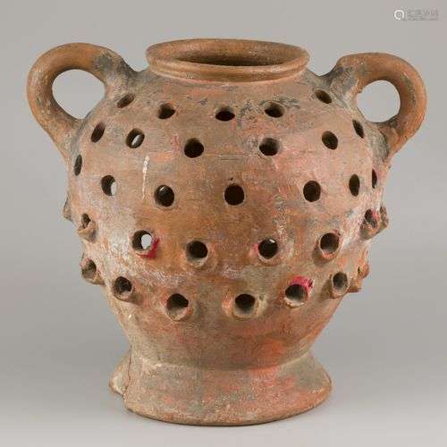 A terracotta so-called strawberry pot or herb garden.