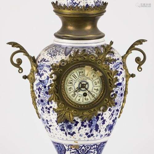 An earthenware vase pendulum with brass fittings, Dutch, ca....