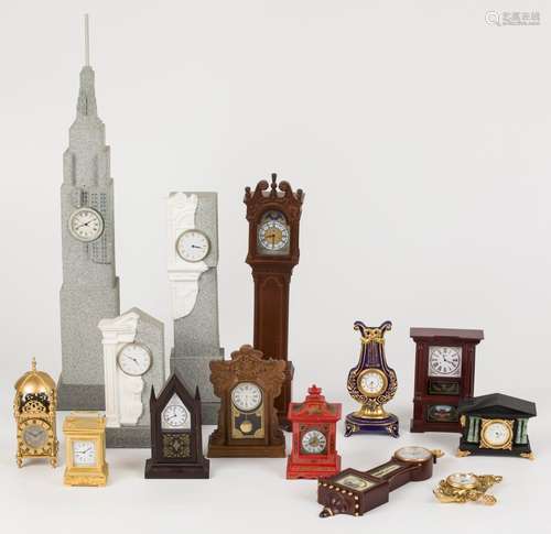 A lot consisting of miniature clocks in the shape of a stand...