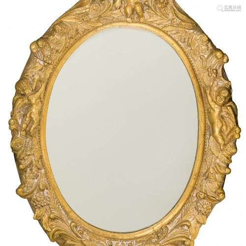 An oval gold painted mirror frame with decorative relief, 2n...