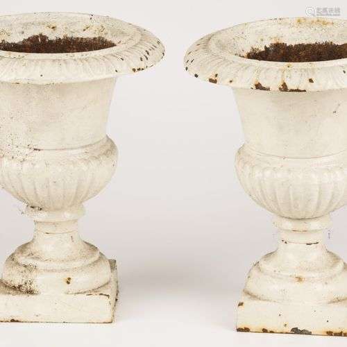 A set of (2) small cast iron garden vases, 20th century.