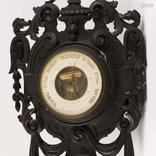 A carved and blackened wooden Louis XVI-style barometer, Fra...