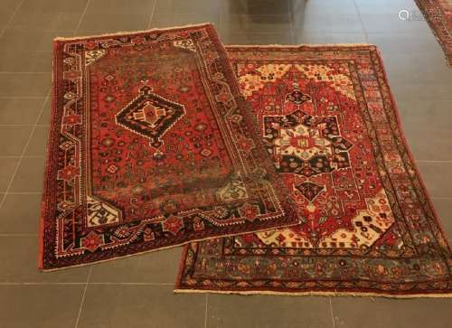 A lot comprised of (2) Persian rugs, Iran, 20th century.