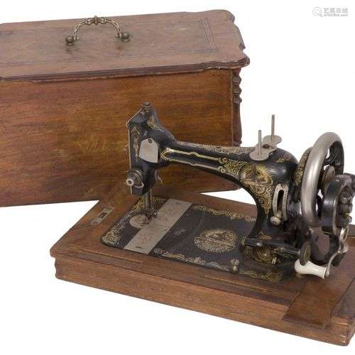 A sewing machine in its original case, Germany(?), ca. 1900.