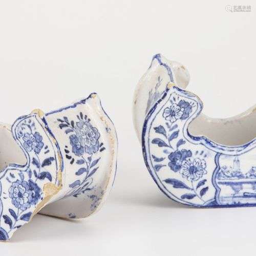 A set of (2) earthenware sledges decorated with a Dutch scen...