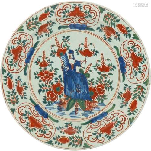 An earthenware polychrome dish decorated by Abundantia. Delf...