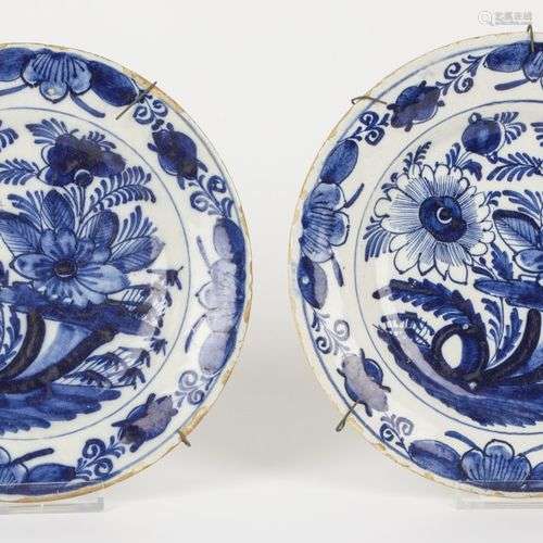 A set of (2) earthenware plates with floral decor. Delft, 18...