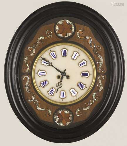 An oeil de boeuf clock, circa 1900.