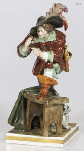 A porcelain Rudolstadt figurine of a musketeer packing his p...
