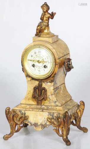 A 19th century matle clock mounted on brass feet and Psyche ...