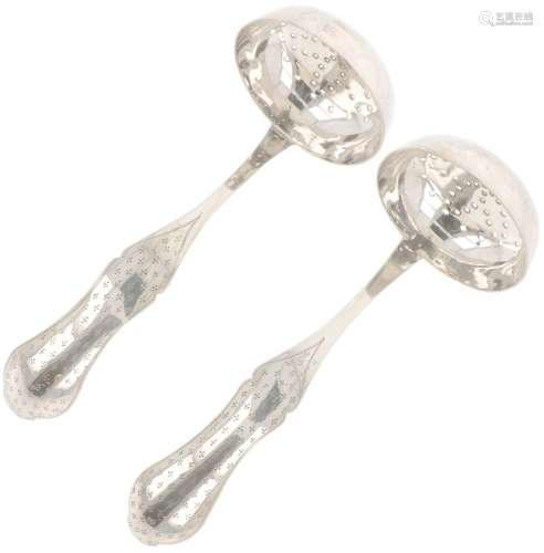 (2) piece set of silver sprinkler spoons.