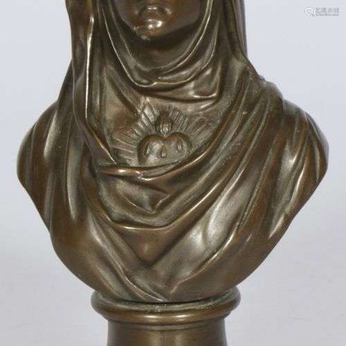 A bonze bust of the Virgin Mary with the immaculate heart.