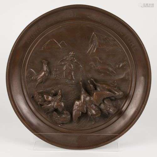 A bronze commemorative dish with high relief of a peasantwom...