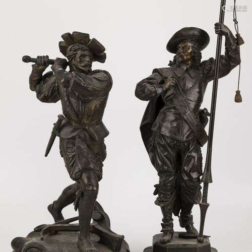 A lot comprising (2) ZAMAC sculptures of a soldier wielding ...