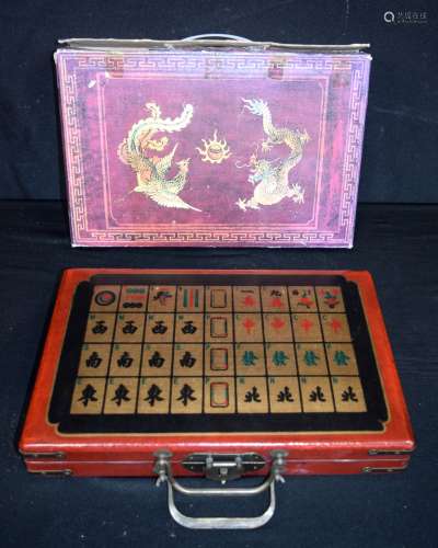 A cased set of bamboo and bone Mahjong tiles. 32 x 22cm