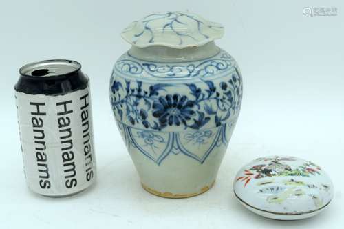 A Chinese porcelain lidded vase decorated with foliage, toge...