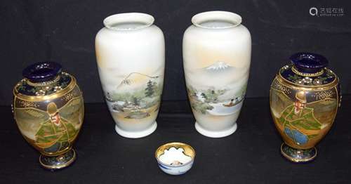 A pair of Japanese Kutani vases, together with two other Jap...