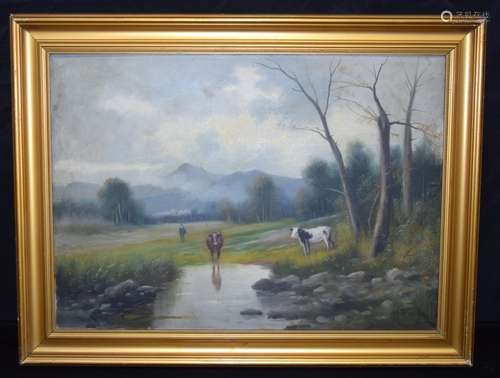 A framed oil on canvas of cattle grazing by a stream 49 x 69...