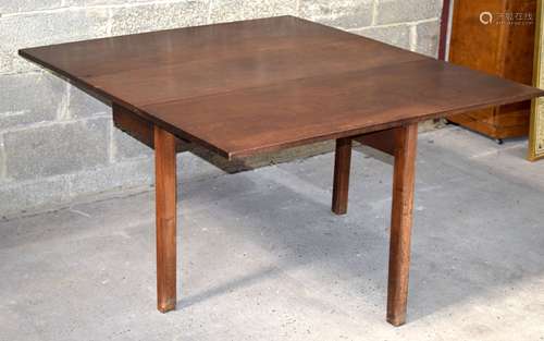 A large antique wooden fold down dining table 71 x 137 x 122...