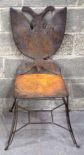 A metal butterfly backed garden chair 105 x 43cm.