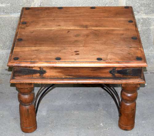 A small Indian wooden low table with metal studding. 41 x 60...