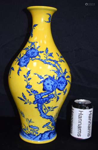 A Chinese porcelain yellow ground vase decorated with peache...