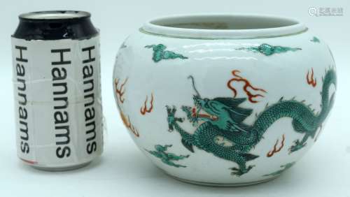 A Chinese porcelain bowl decorated with dragons and clouds. ...