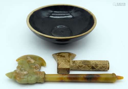 A small Chinese jade axe carved in the form of a dragon toge...
