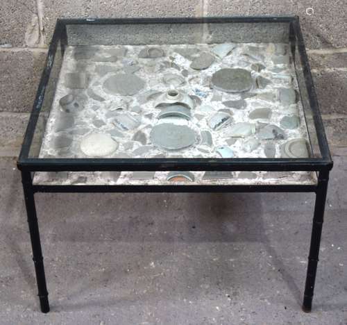 An unusual cast iron glass top table with a under glass disp...