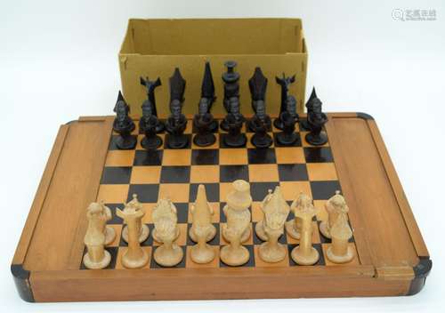 A Tribal African Village chess set together with a Travellin...