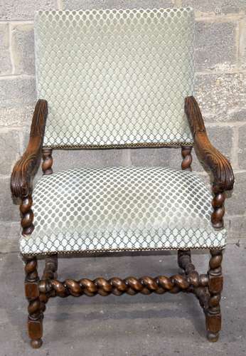 A Victorian carved oak barley twist upholstered throne chair...