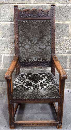 A 18/19th century carved wooden carver chair with upholstere...