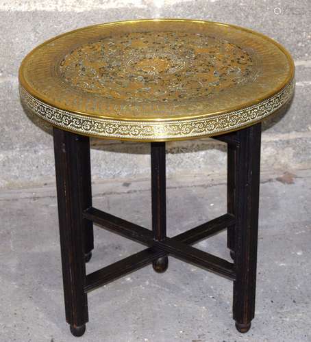 A heavily embossed brass top table decorated with birds 60 x...