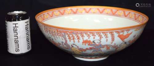 A Chinese porcelain Sancai bowl decorated with children in v...