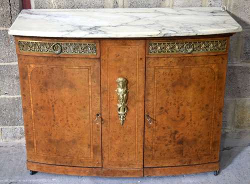 A marble topped two door walnut cabinet with gilt bronze mou...