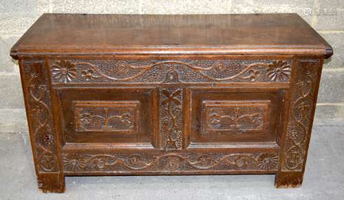 A large 18/19th century carved antique lidded chest with flo...