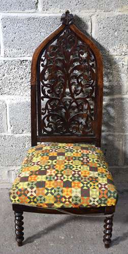 A small 19th century carved wood chair with upholstered seat...