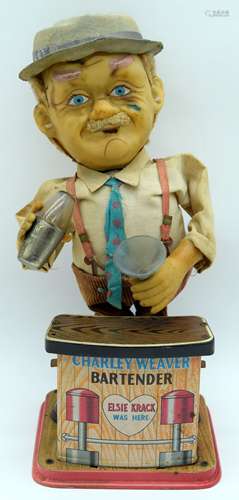 A vintage Tin plate battery powered model of Charley Weaver ...