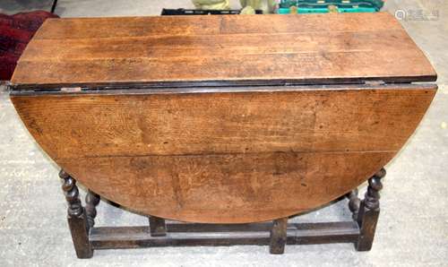 A large 17/18th Century Oak gate leg table with barley twist...